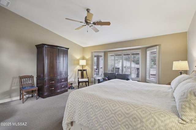 bedroom featuring ceiling fan, light colored carpet, and vaulted ceiling