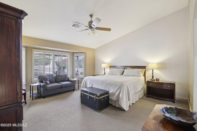 bedroom featuring light carpet, lofted ceiling, and ceiling fan