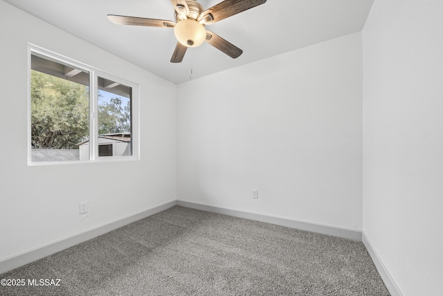 empty room with carpet flooring and ceiling fan