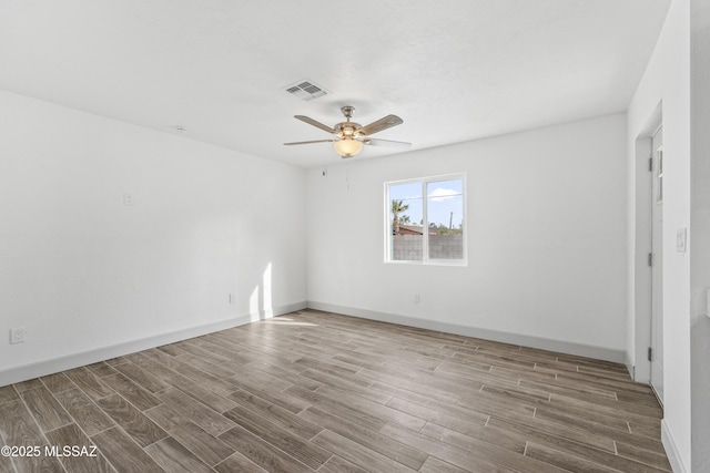 unfurnished room featuring hardwood / wood-style flooring and ceiling fan