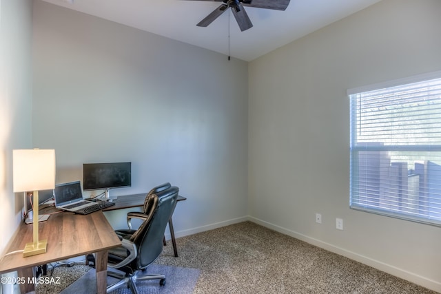 home office with ceiling fan and carpet