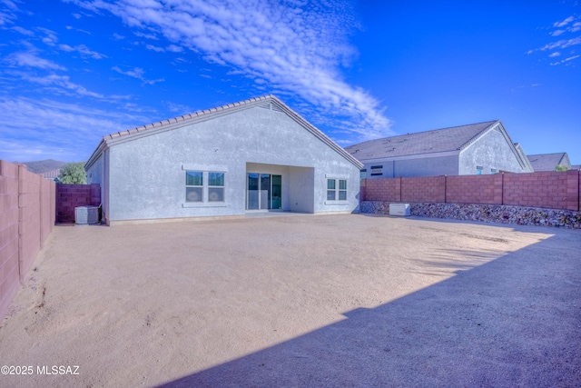 back of property featuring central AC unit