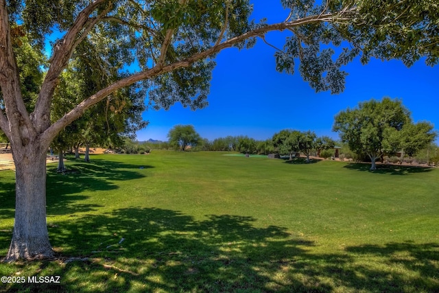 surrounding community featuring a lawn