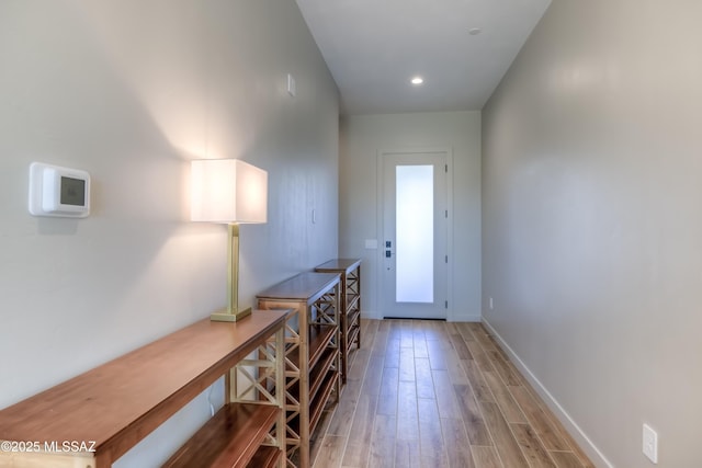 entryway with wood-type flooring