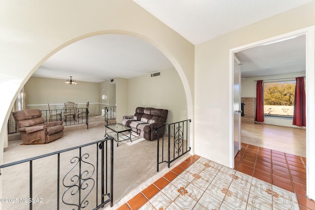 interior space with tile patterned flooring and a textured ceiling