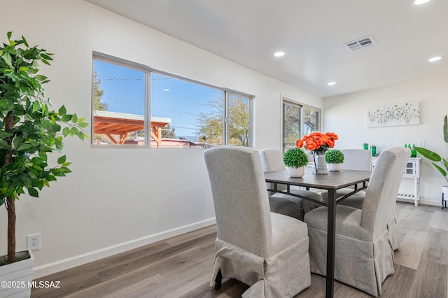 dining room with hardwood / wood-style floors