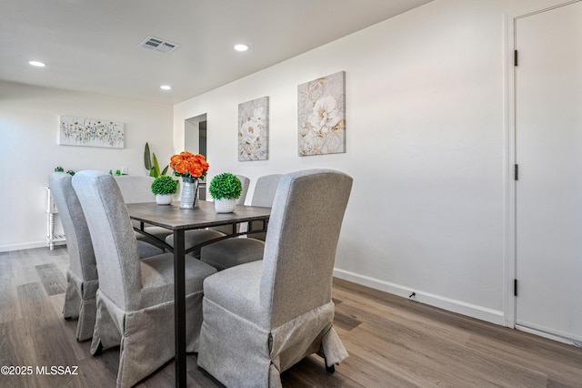 dining room with wood-type flooring