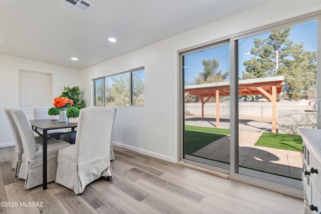 dining area with light wood-type flooring