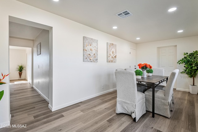 dining room with light hardwood / wood-style flooring