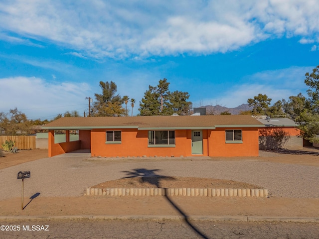 single story home with a carport