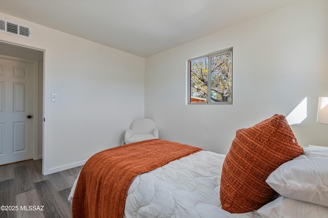 bedroom featuring hardwood / wood-style flooring