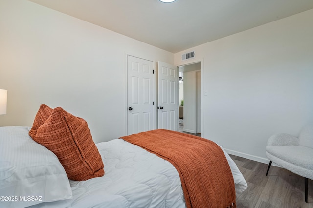 bedroom with hardwood / wood-style flooring