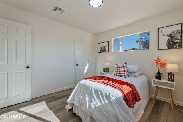 bedroom featuring hardwood / wood-style floors