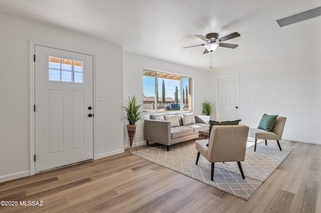 foyer featuring ceiling fan and light hardwood / wood-style flooring