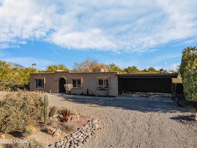 single story home with a carport