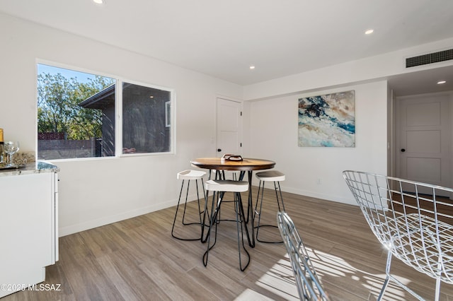 dining area featuring light wood-type flooring