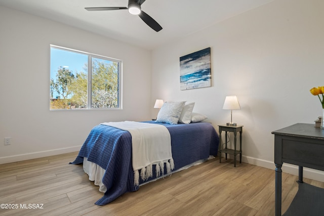 bedroom featuring ceiling fan and light wood-type flooring