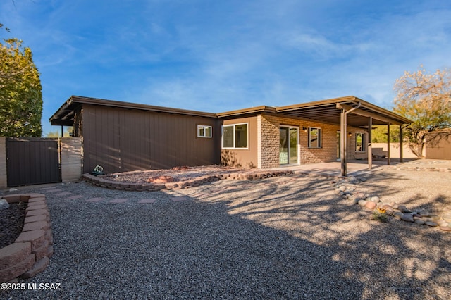 rear view of property with a patio area