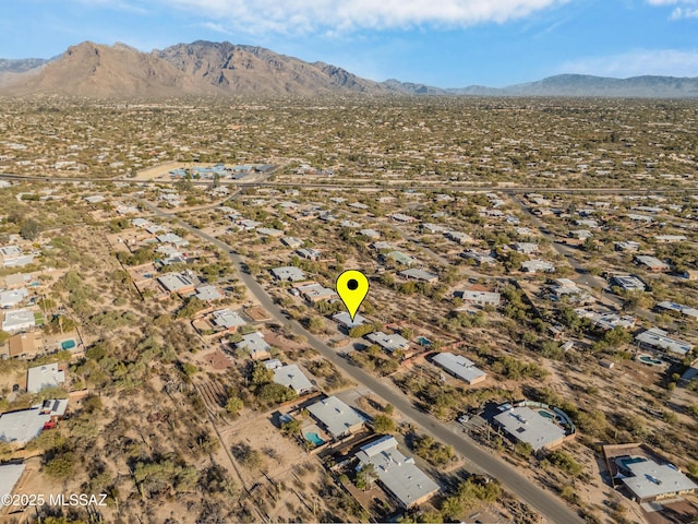 birds eye view of property featuring a mountain view