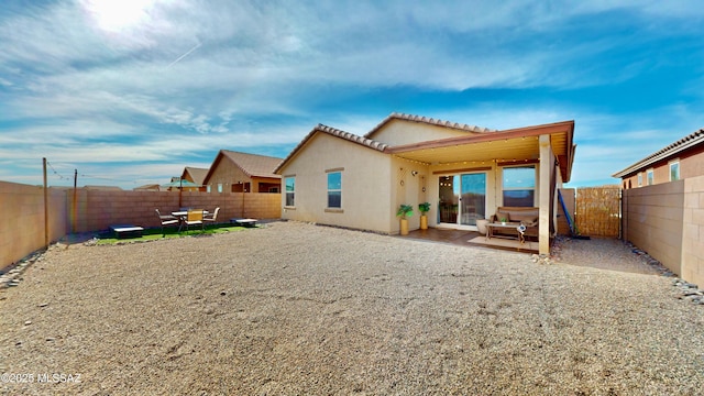 rear view of house featuring a patio area