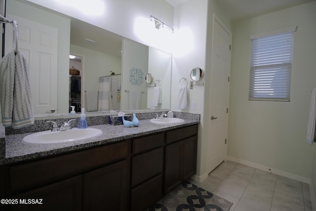 bathroom with tile patterned flooring and vanity