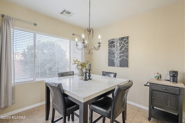 tiled dining area with a notable chandelier