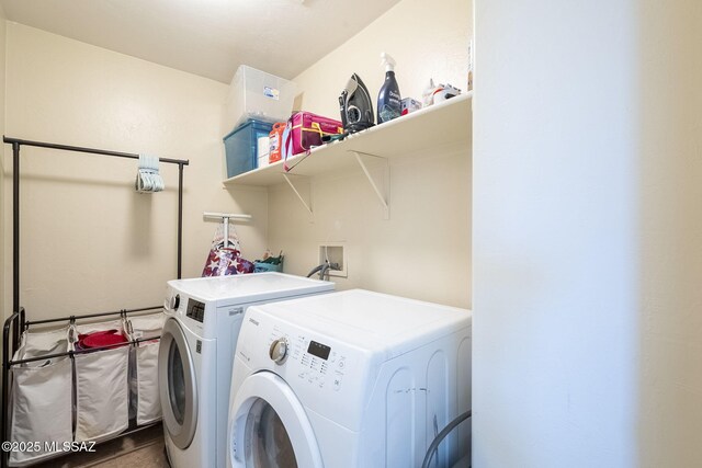 washroom with washer / dryer and light hardwood / wood-style floors