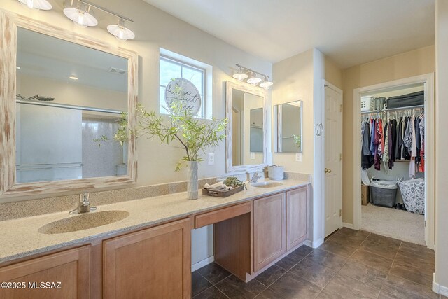 bathroom with vanity and an enclosed shower