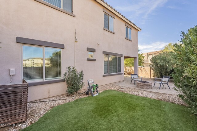 view of patio / terrace with a fire pit