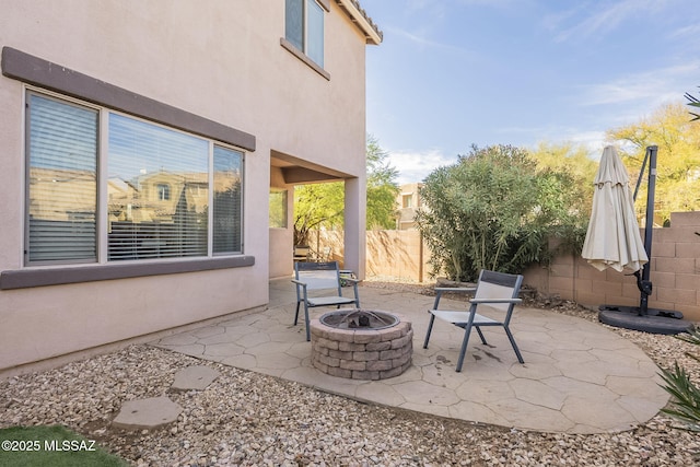 view of patio / terrace featuring an outdoor fire pit