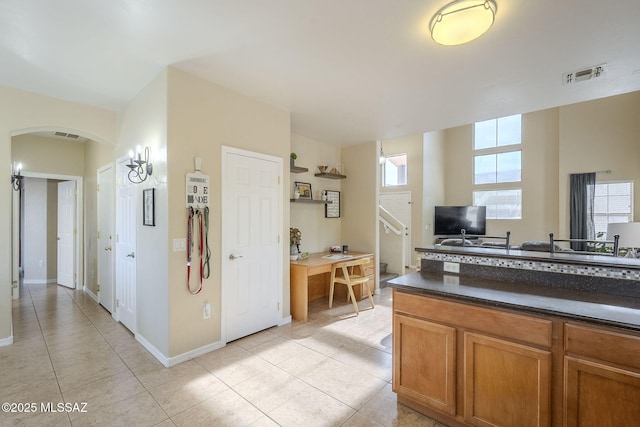 kitchen with light tile patterned floors