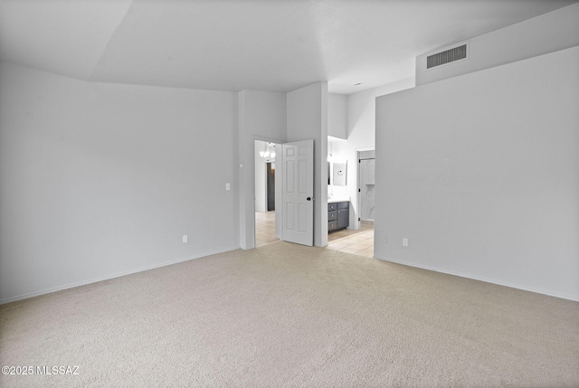 unfurnished room with light colored carpet