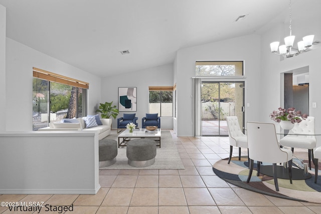 living room featuring plenty of natural light, light tile patterned flooring, and lofted ceiling