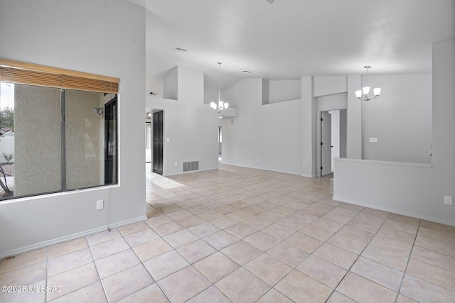 interior space featuring vaulted ceiling and a notable chandelier