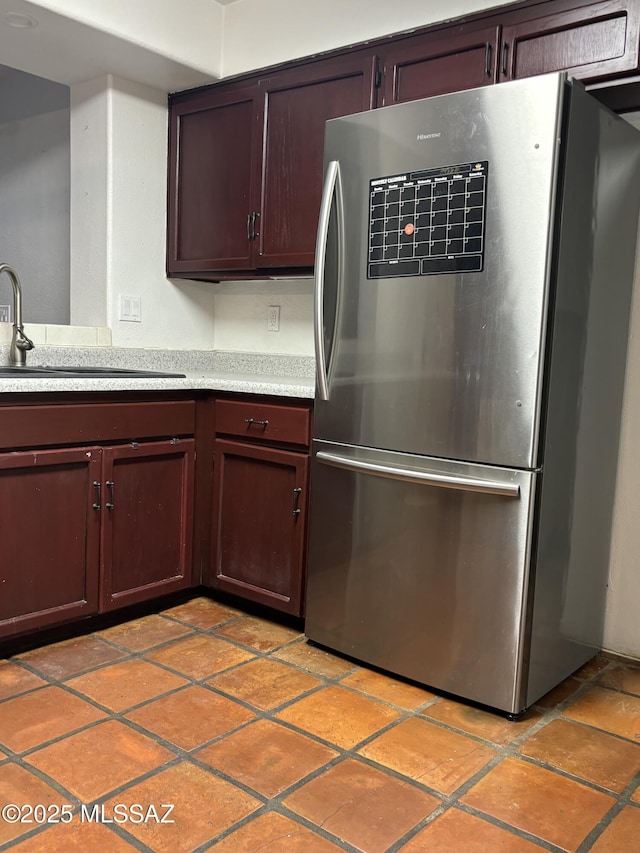 kitchen with sink and stainless steel fridge