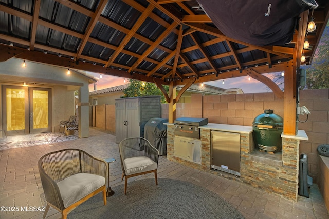 view of patio with a gazebo, grilling area, and exterior kitchen