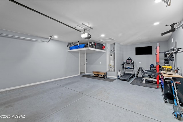 garage with a garage door opener and water heater