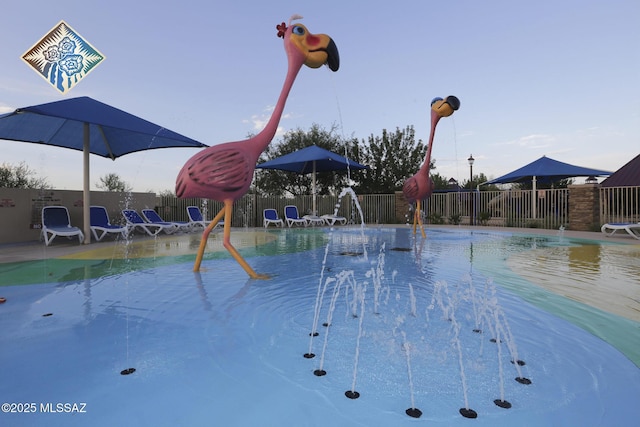 view of pool with pool water feature