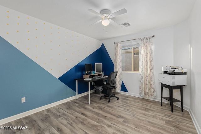 office featuring ceiling fan, wood-type flooring, and vaulted ceiling