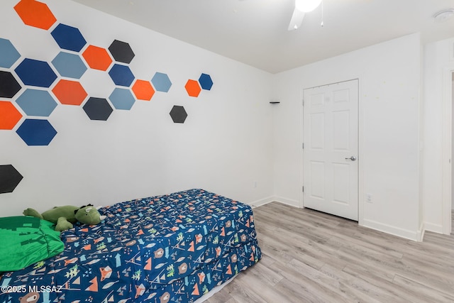 bedroom featuring ceiling fan and hardwood / wood-style flooring