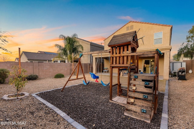 view of playground at dusk