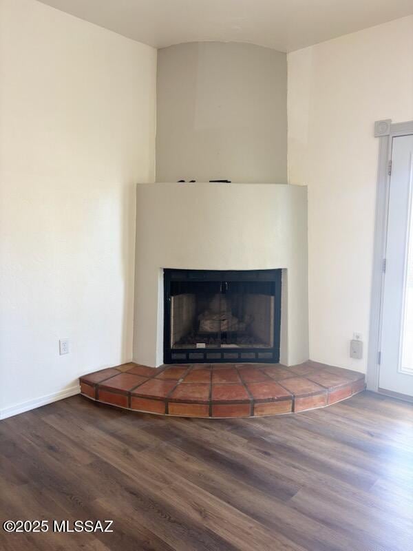 interior details with a fireplace and hardwood / wood-style floors