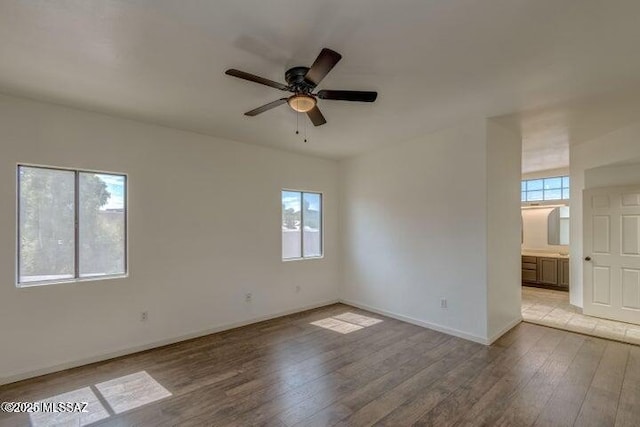 unfurnished room featuring ceiling fan and light hardwood / wood-style flooring