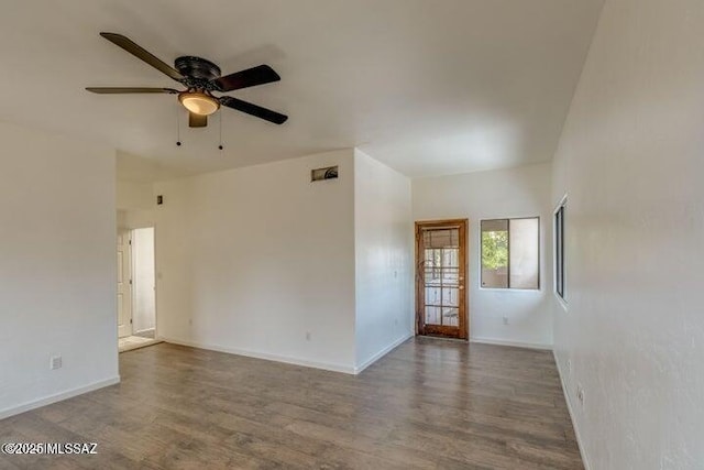 unfurnished room featuring hardwood / wood-style flooring and ceiling fan