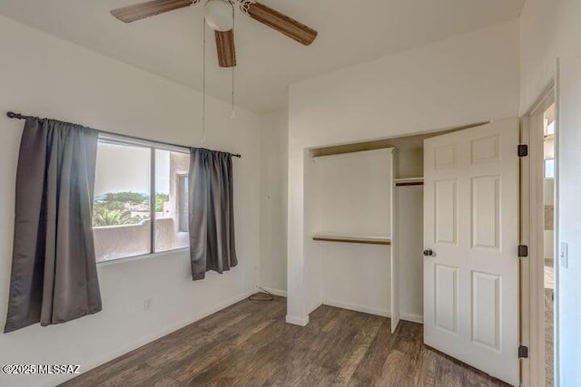 unfurnished bedroom with a closet, ceiling fan, and dark hardwood / wood-style floors