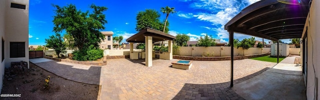 view of patio / terrace featuring a storage unit