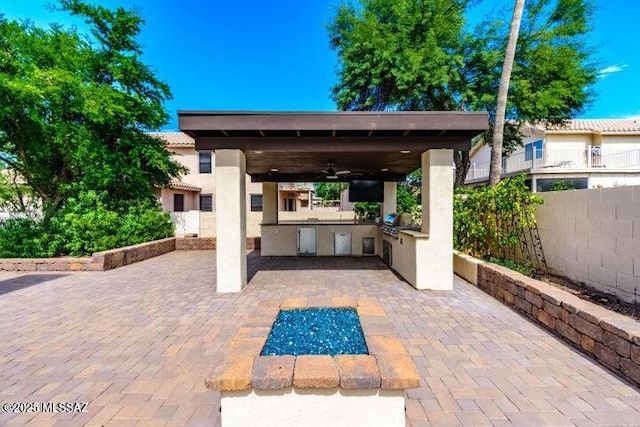 view of patio featuring ceiling fan and area for grilling