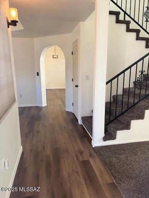 corridor featuring dark hardwood / wood-style flooring