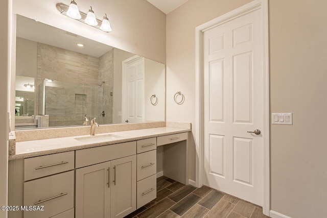 bathroom with vanity and a shower