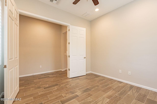 unfurnished bedroom featuring ceiling fan